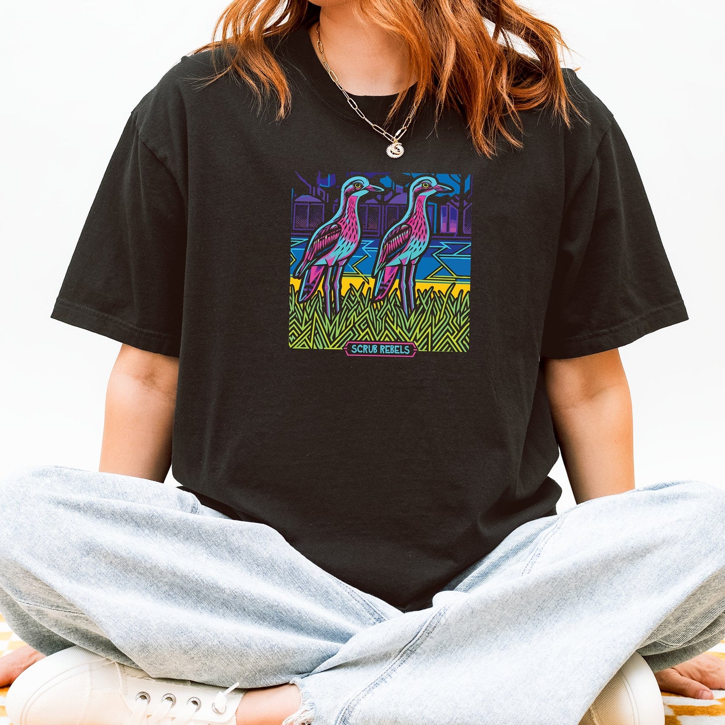 Night Watch Curlew - Female Model wearing black tee with graphic prints of curlews.