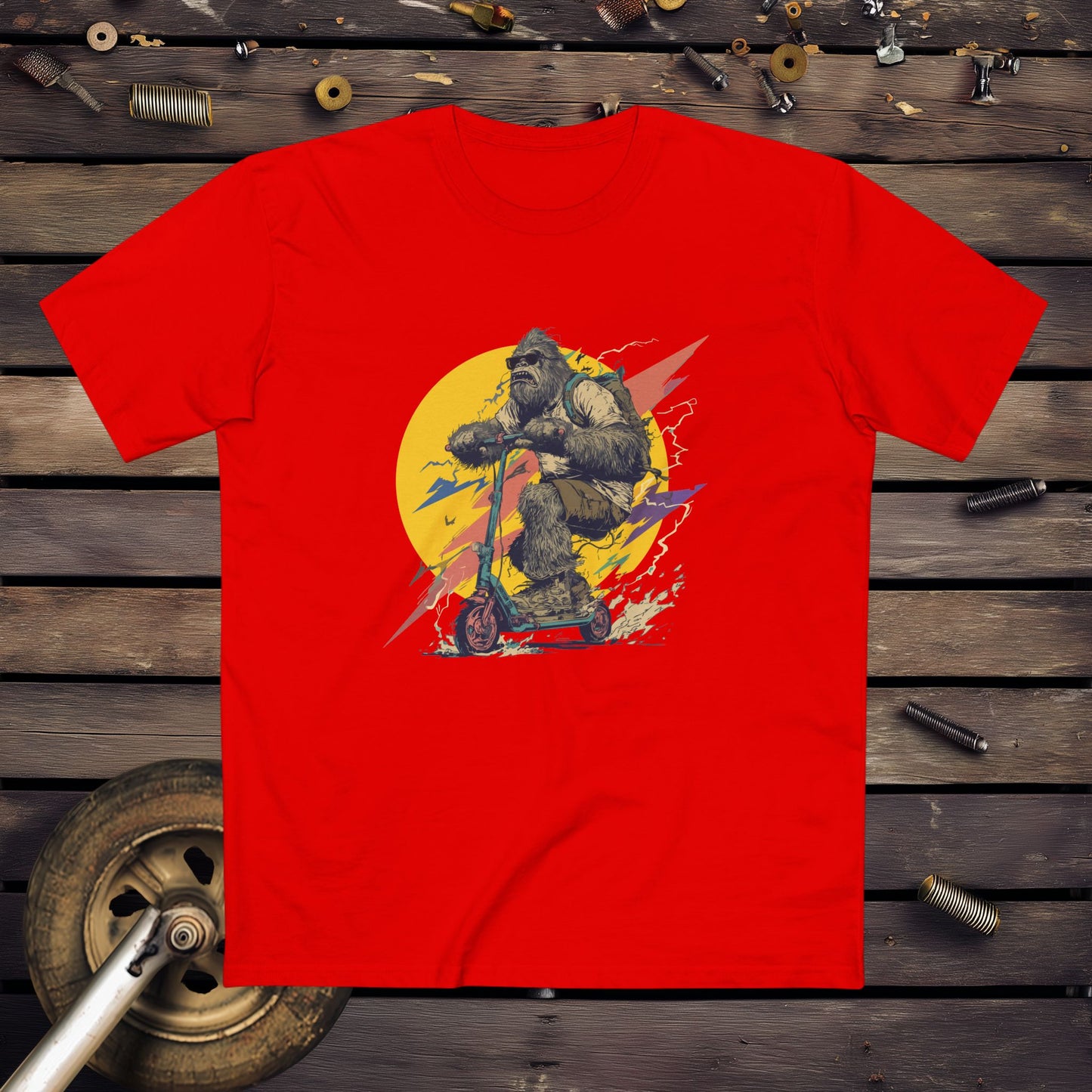 Red t-shirt with a graphic design of a Yowie on a scooter background