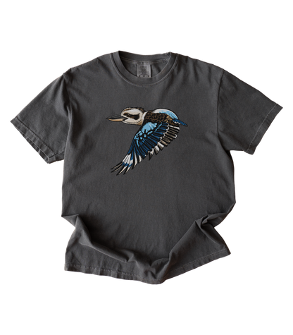 A dark charcoal gray t-shirt featuring a detailed graphic of a flying kookaburra bird on the chest, displayed against a solid white background.