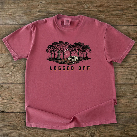 Logged Off camping shirt, t-shirt with a detailed screen-printed design of a smoking campfire and a dome tent nestled among towering Ghost Gums in the Australian bush.