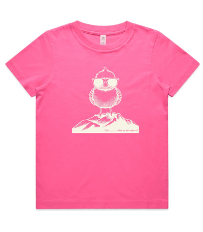 A bright pink short-sleeve t-shirt with a cream-colored graphic of an owl wearing sunglasses on a mountain peak, displayed flat against a white background.