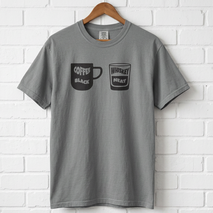 Gray t-shirt with coffee and whiskey graphic on a white brick wall background