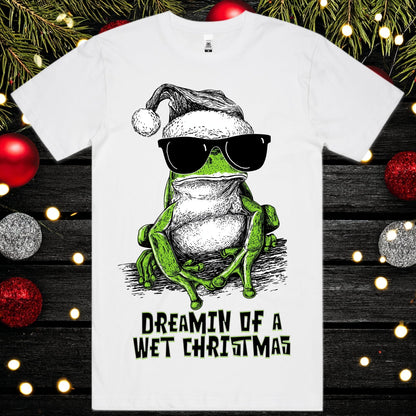 Dreamin of a wet christmas - Christmas Tee - Frog Tee Christmas Mockup on a background of christmas decorations