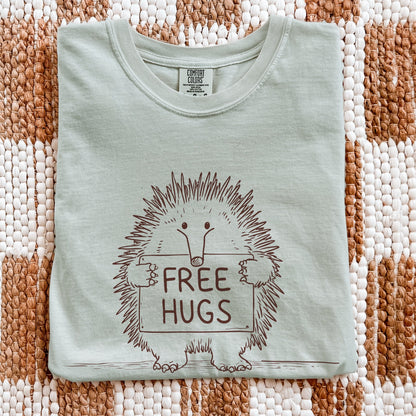 Free Hugs echidna graphic tee on flatlay display