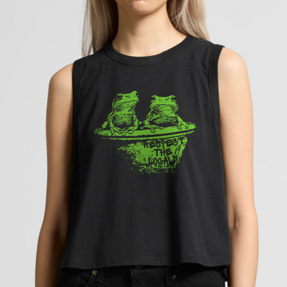 AS COLOUR Crop tank Top with a print of two green tree frogs sitting on a toilet and the text  Respect the Locals