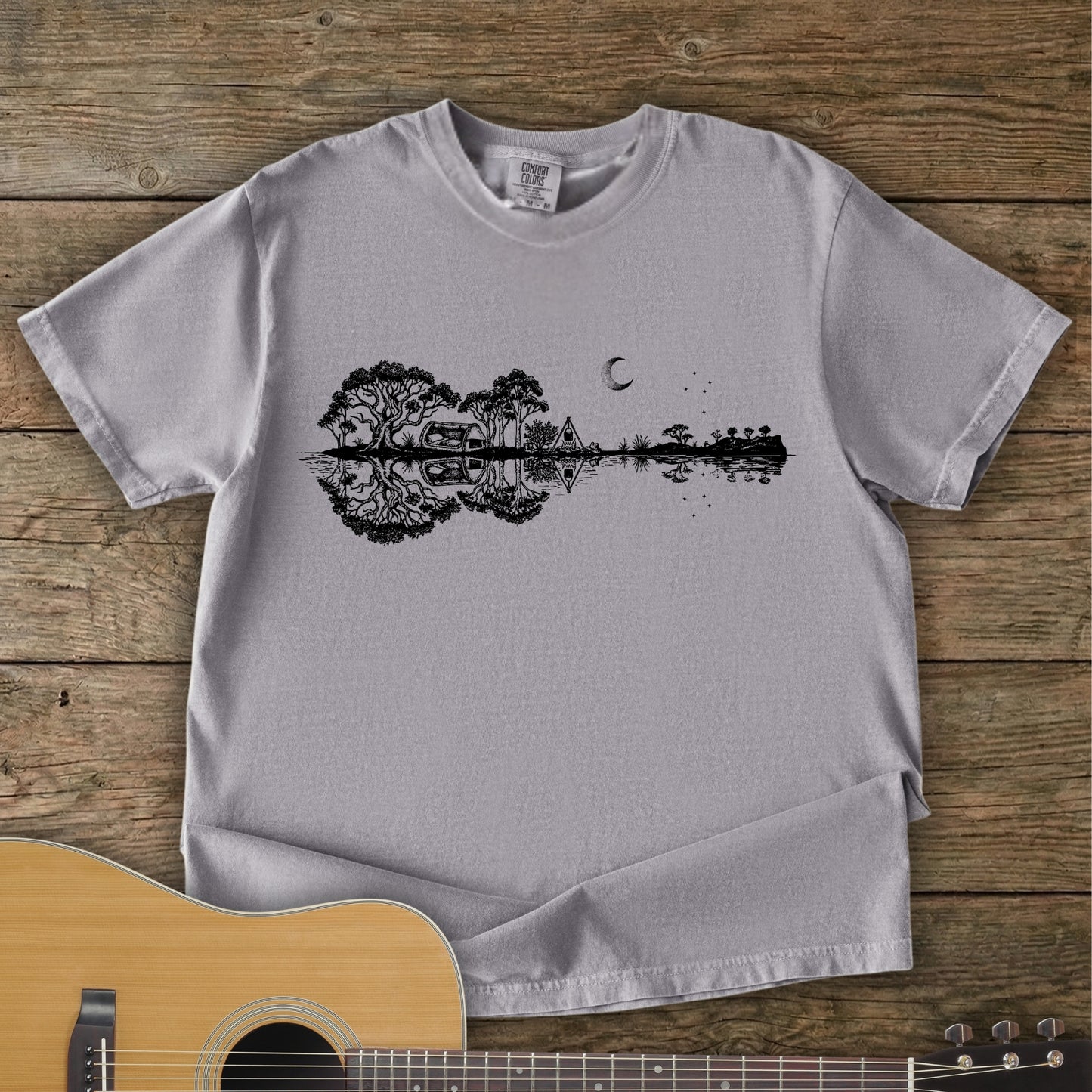 Grey Colour Southern Stars Guitar Tee featuring a lakeside campsite reflection in a guitar silhouette under an Australian night sky.