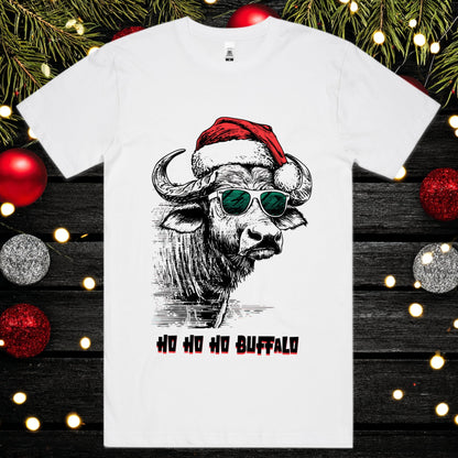 White t-shirt with a buffalo wearing a Santa hat and sunglasses design, surrounded by Christmas decorations.