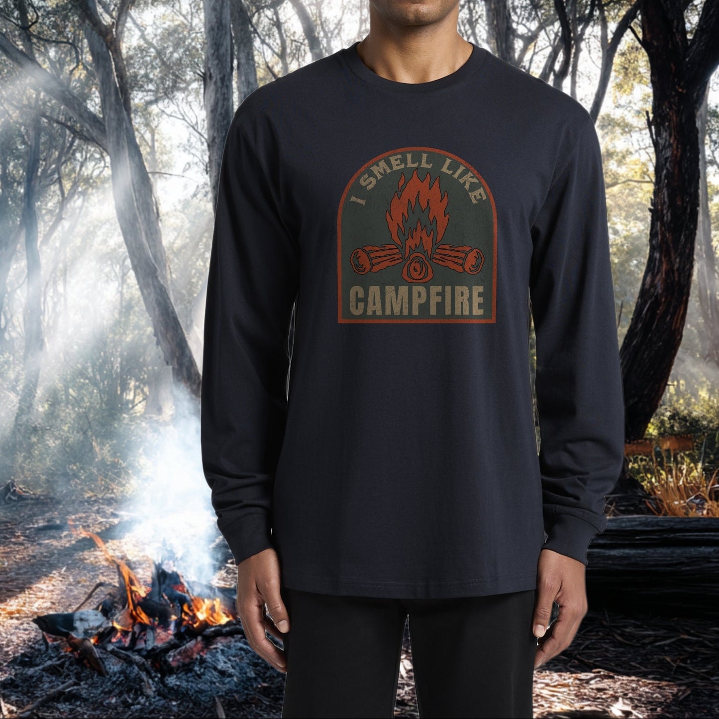 Person wearing a long-sleeve shirt with 'I smell Like Campfire' design in a Australian gumtree forest setting.