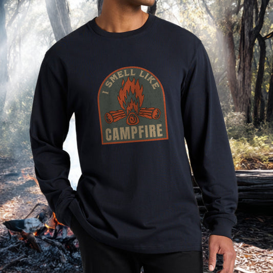 I smell like campfire long sleeve t-shirt worn by a man in a forest