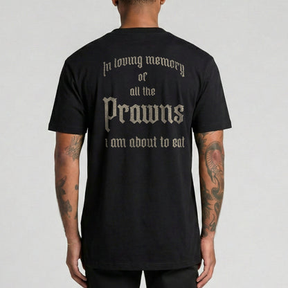 Person wearing a black t-shirt with text on the back, standing against a plain background