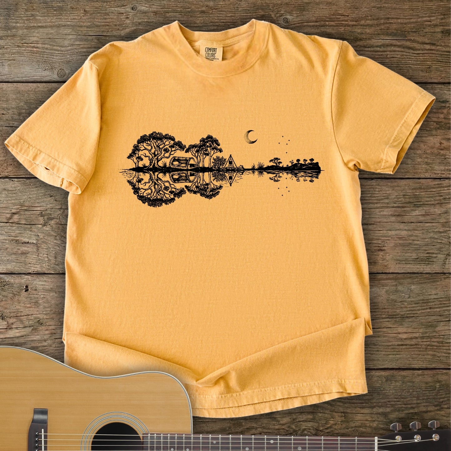 Mustard Colour Southern Stars Guitar Tee featuring a lakeside campsite reflection in a guitar silhouette under an Australian night sky.