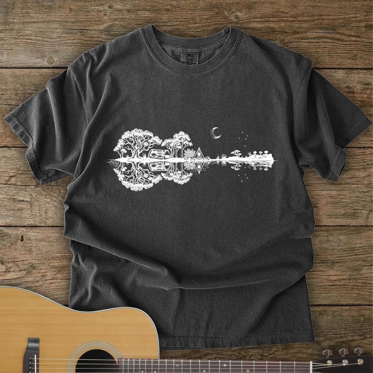 Pepper Colour Southern Stars Guitar Tee featuring a lakeside campsite reflection in a guitar silhouette under an Australian night sky.