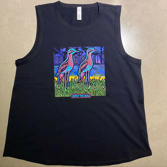 A black sleeveless tank top laid flat on a beige textured surface, featuring a colorful graphic print of two curlew birds in a stylized scene on the front.