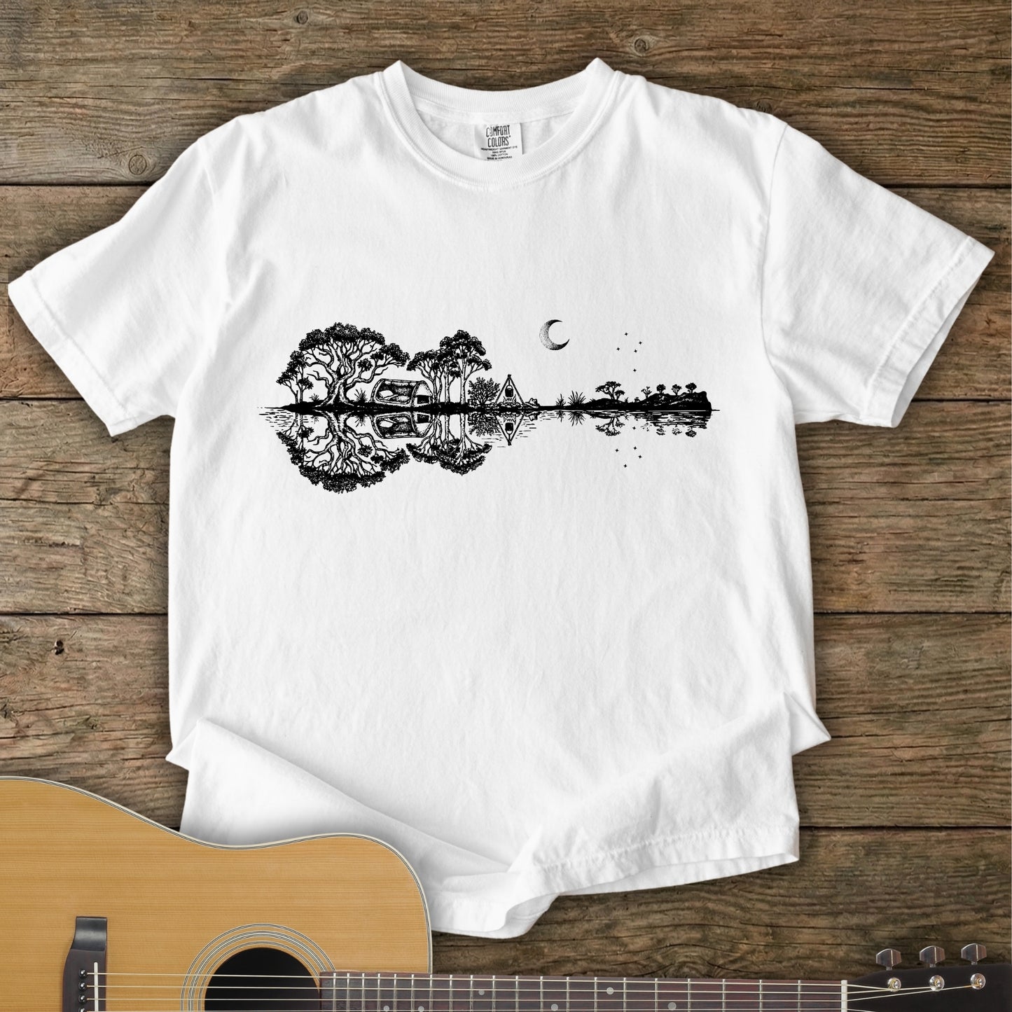 White Colour Southern Stars Guitar Tee featuring a lakeside campsite reflection in a guitar silhouette under an Australian night sky.