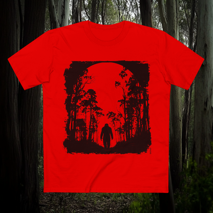 Bigfoot - Yowie T-shirt with dark forest silhouette and full moon design printed on red tee, bold outdoor theme by GhostGum Tees.