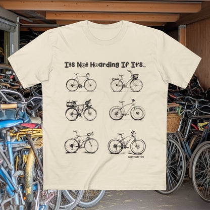 Off-White T-shirt featuring hand-drawn illustrations of six different bikes with the caption “It’s Not Hoarding If It’s...” — cycling-themed graphic tee by GhostGum Tees.