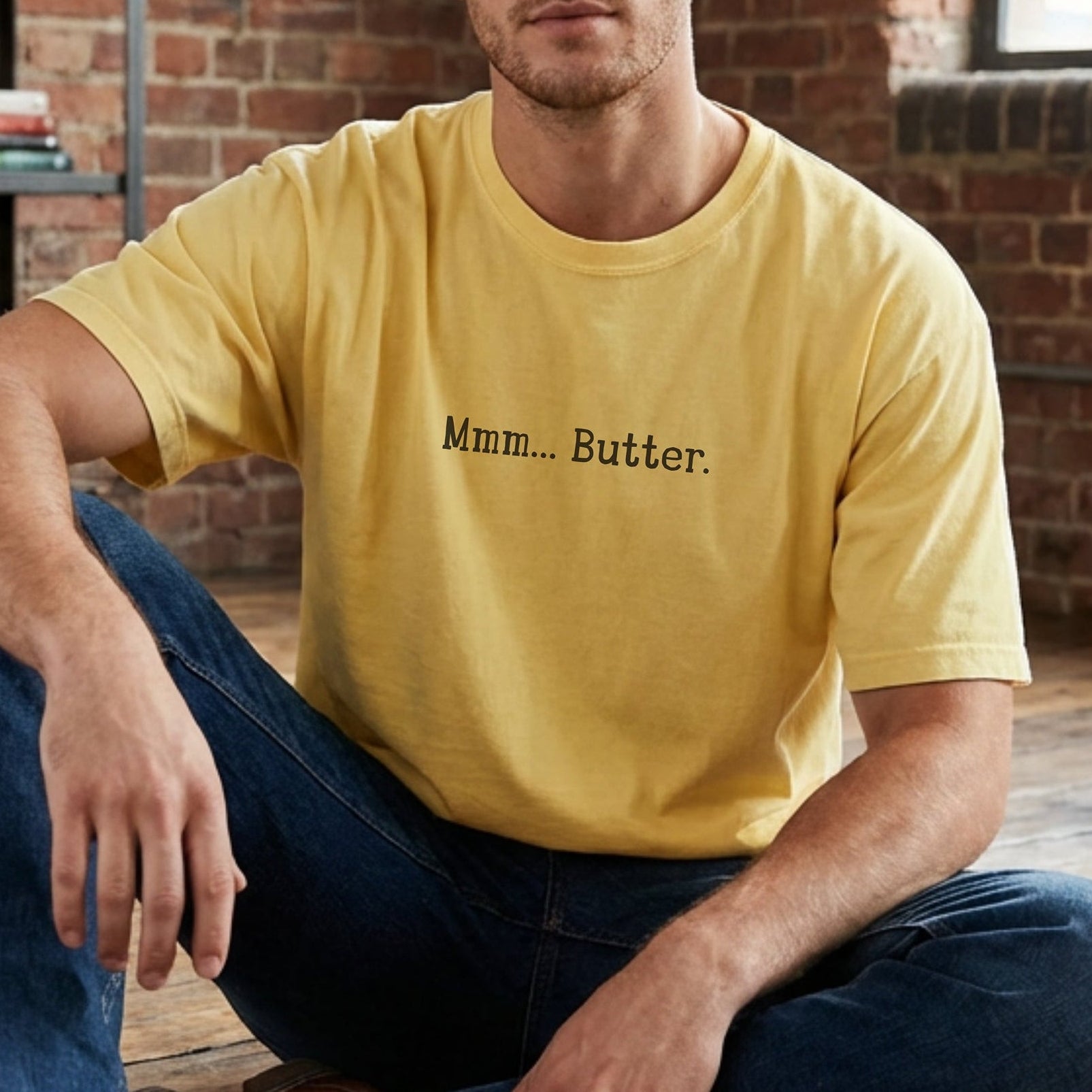 butter yellow vintage wash t-shirt featuring the text Mmm Butter in black, worn by male model