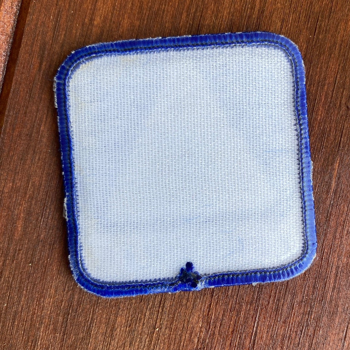 Reverse sticky side of trail patch